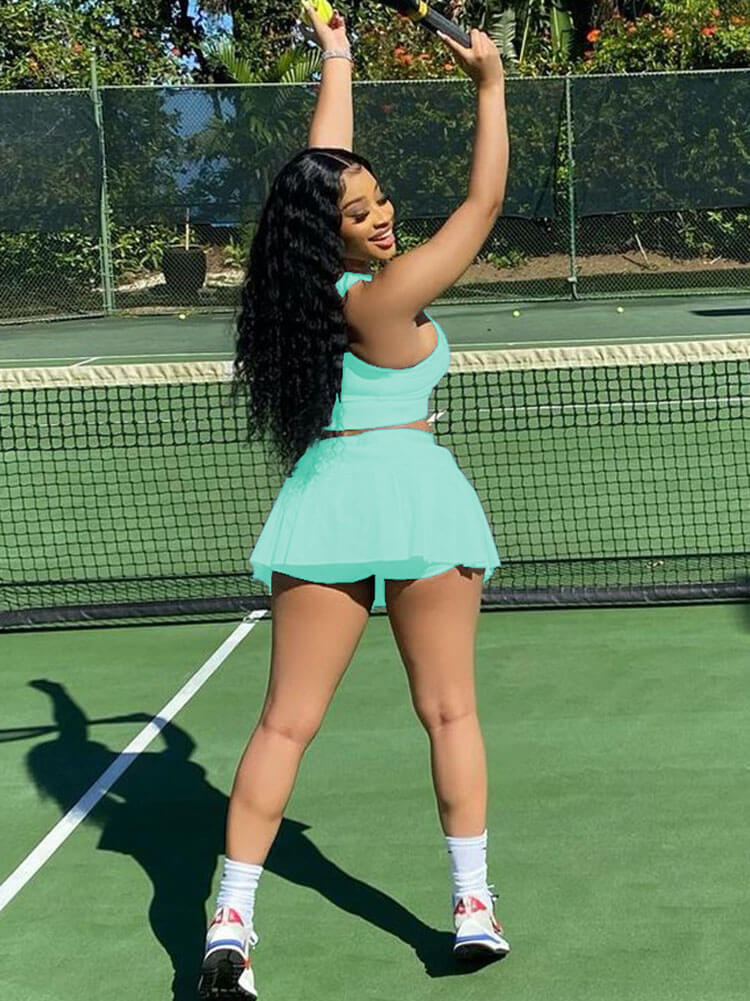 Top corto sin mangas de dos piezas con minifalda plisada