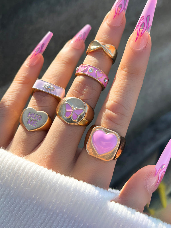 Conjunto de anillos de mariposa rosa y corazón 