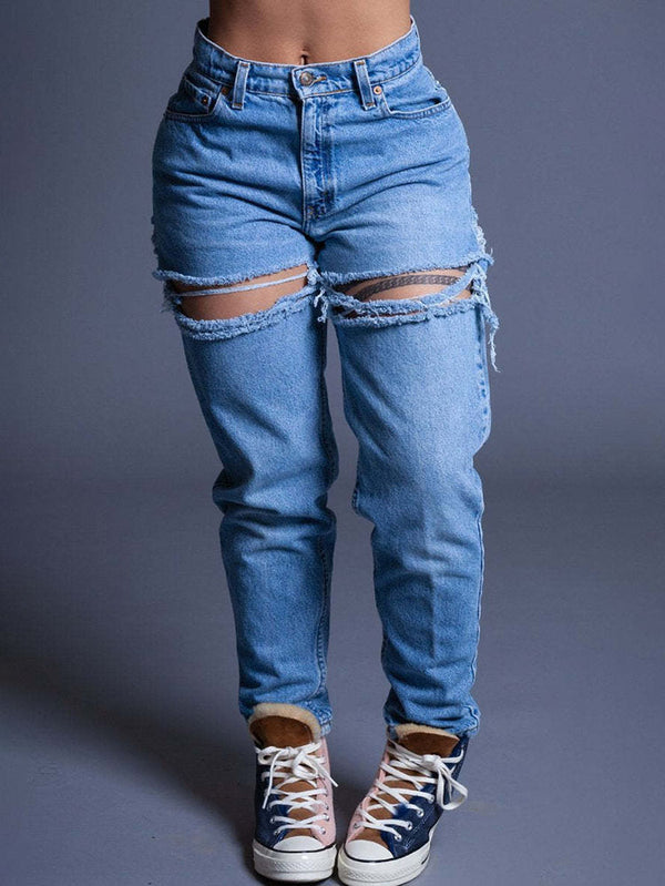 Vaqueros ajustados con cortes rasgados en denim